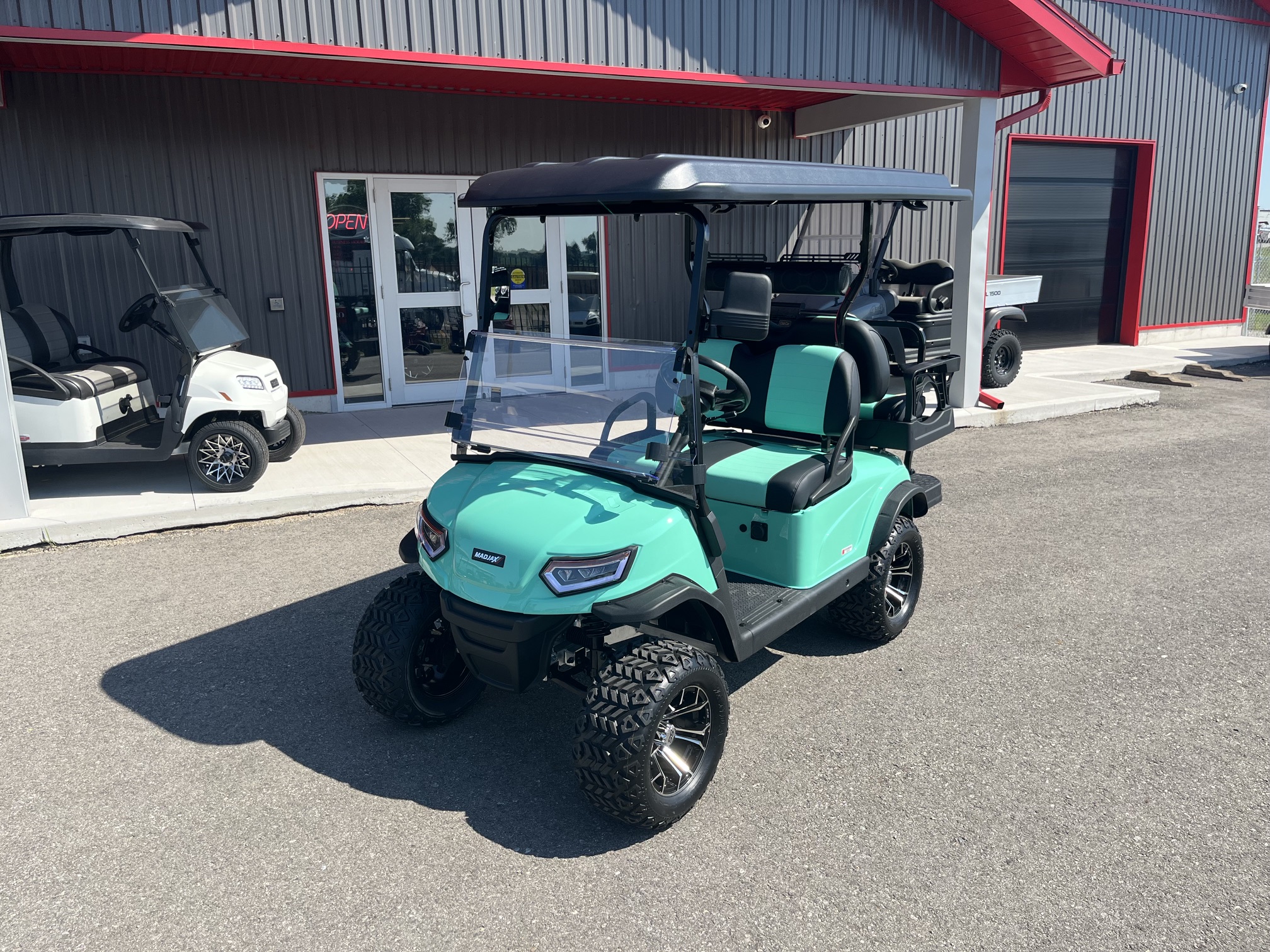 2026 Madjax E Series Lifted Caribbean Green Lithium 4 Passenger Golf Cart
