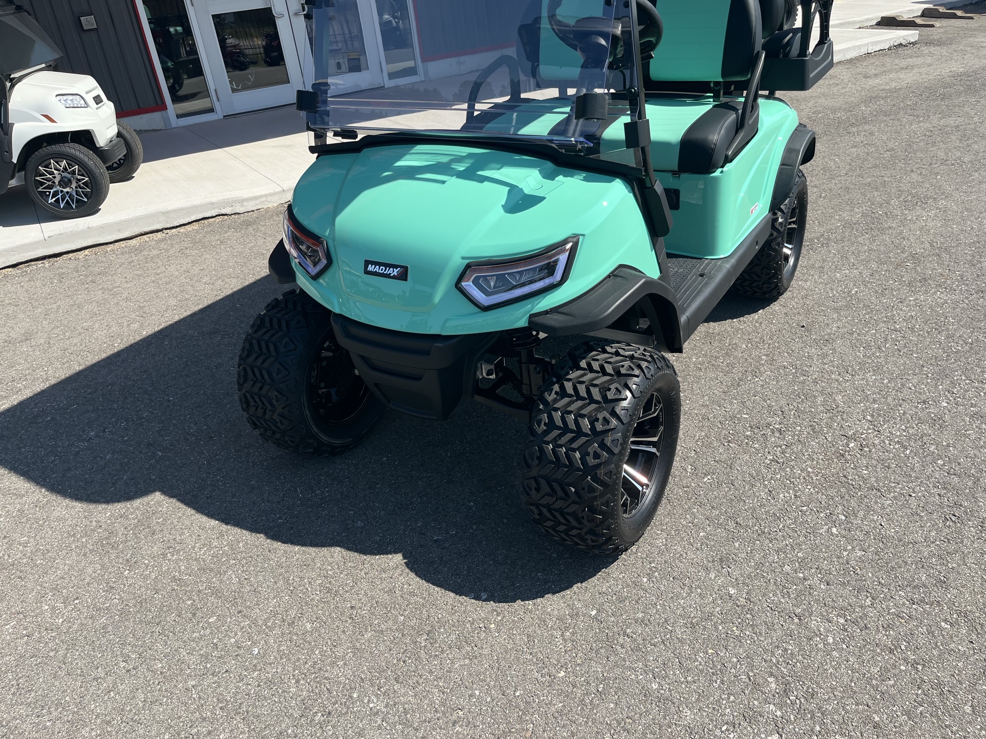 2026 Madjax E Series Lifted Caribbean Green Lithium 4 Passenger Golf Cart