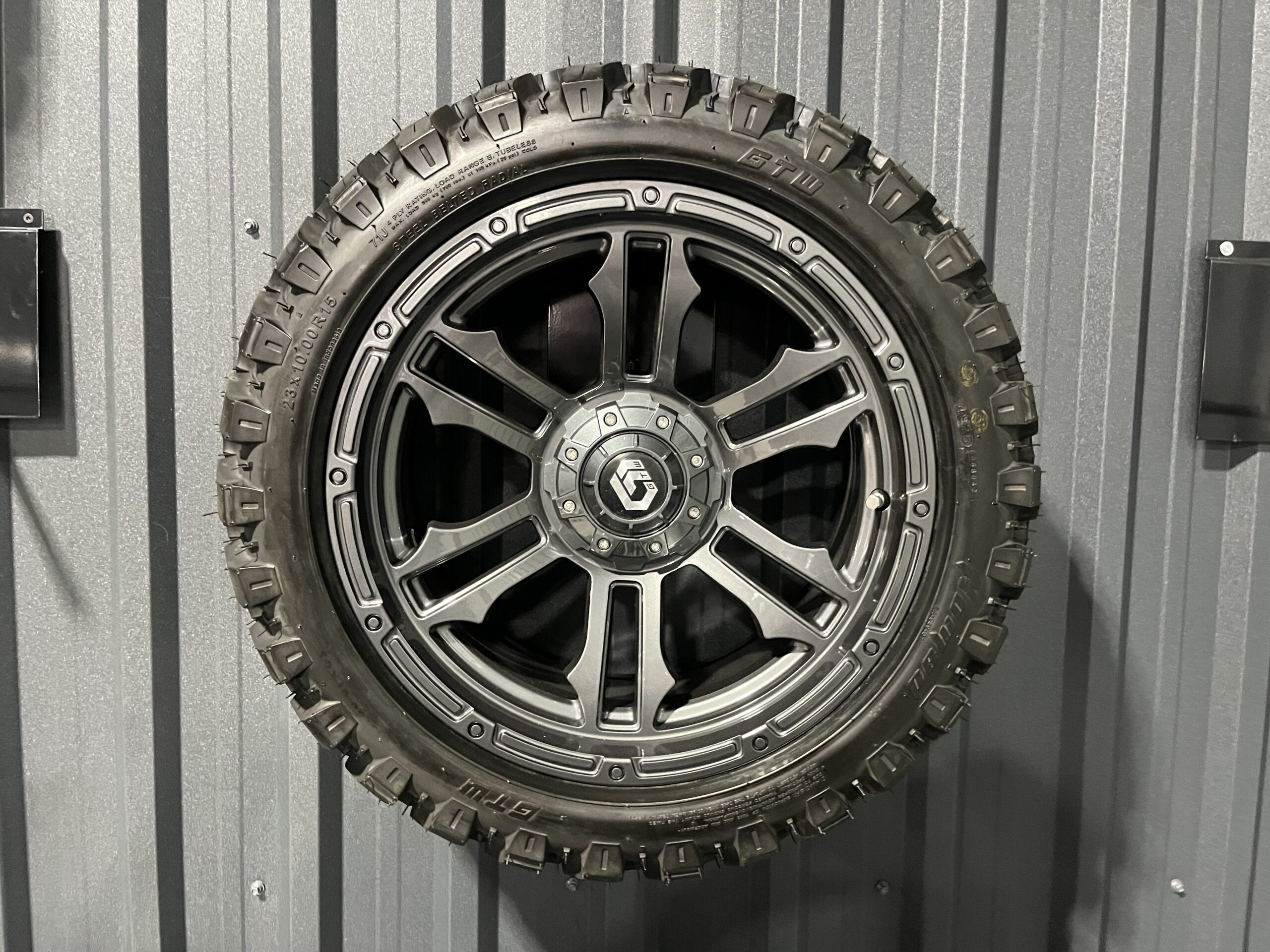 GTW Shogun Gloss Gunmetal 23x10-15 on Nomad All Terrain Tire and Wheel Assembly